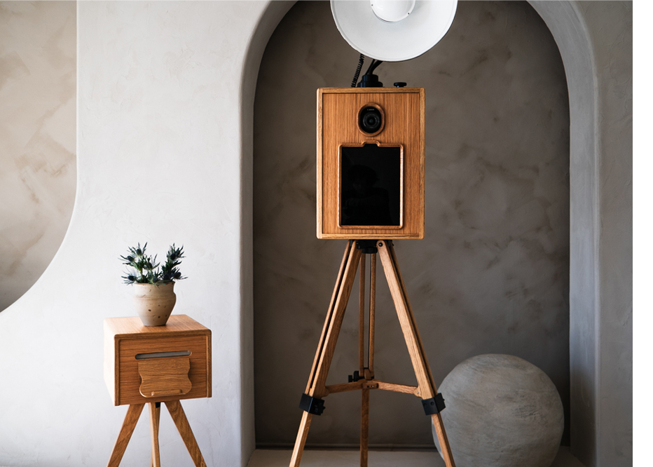 Our Glam Photo Booth rental features a sleek wooden design, perfect for elegant and modern events.