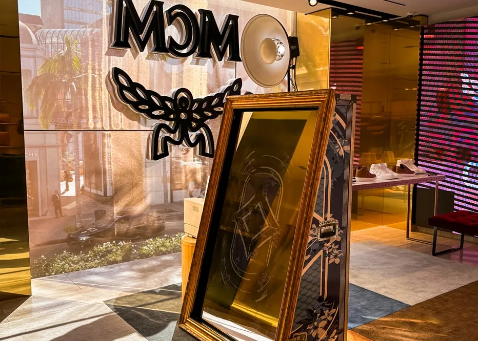 Our Mirror Photo Booth Rental set up at an upscale event, featuring a sleek touch-screen mirror design.