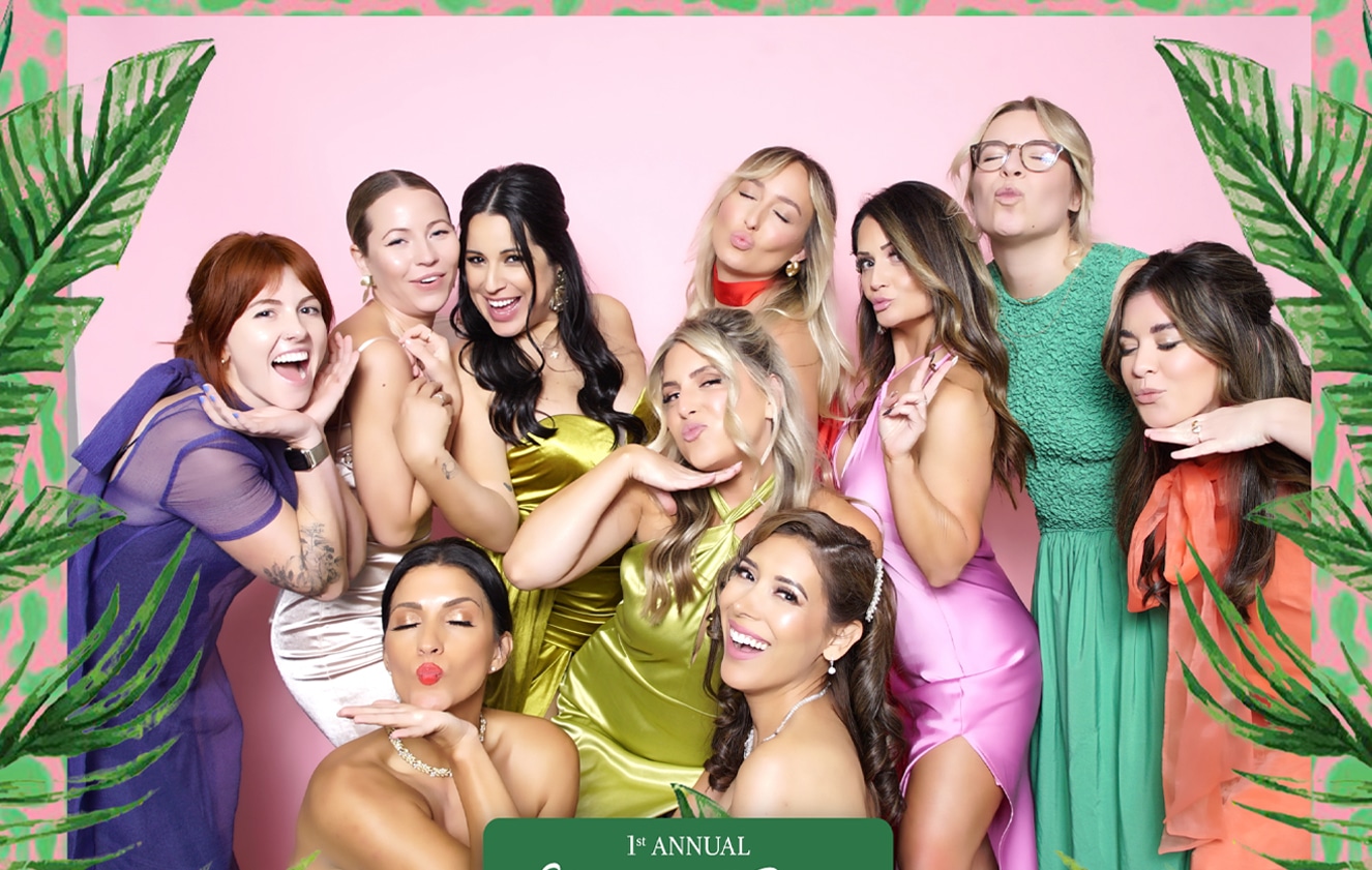 Group of stylish ladies posing in a photo booth at the 1st Annual Curate Gala corporate event.