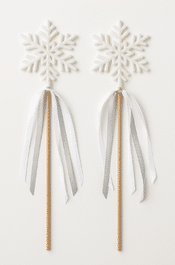 two snowflakes on sticks with white ribbons