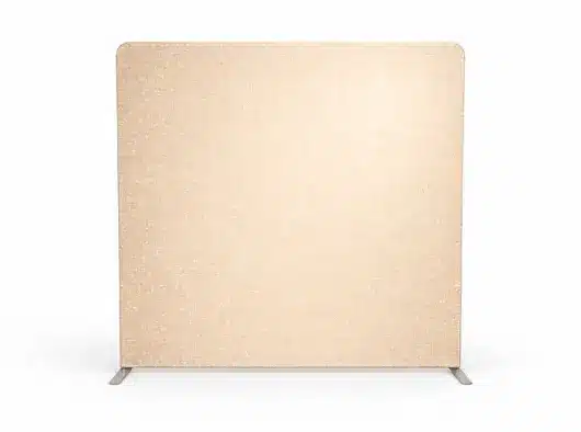 A rectangular, free-standing beige partition with a textured surface sits on a white surface with two small, gray metal feet.