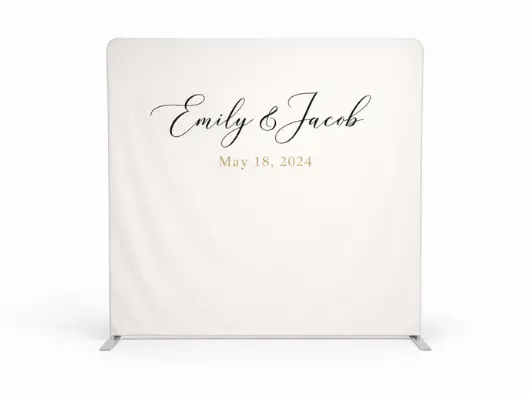 A white backdrop with the names "Emily & Jacob" in calligraphy above "May 18, 2024".