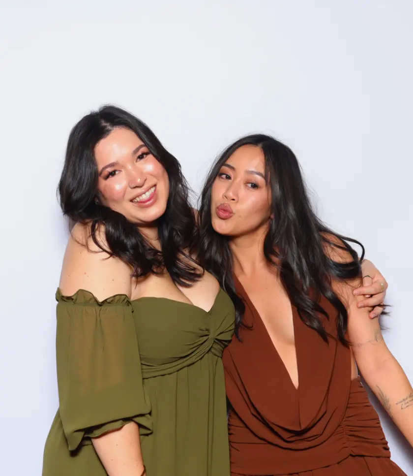 Fun Photo Booth Moment with Playful Expressions Against a White Backdrop