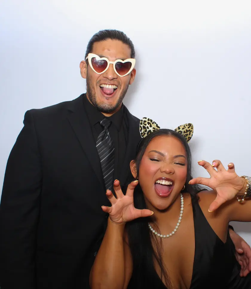 Playful Couple in Fun Props at Photo Booth