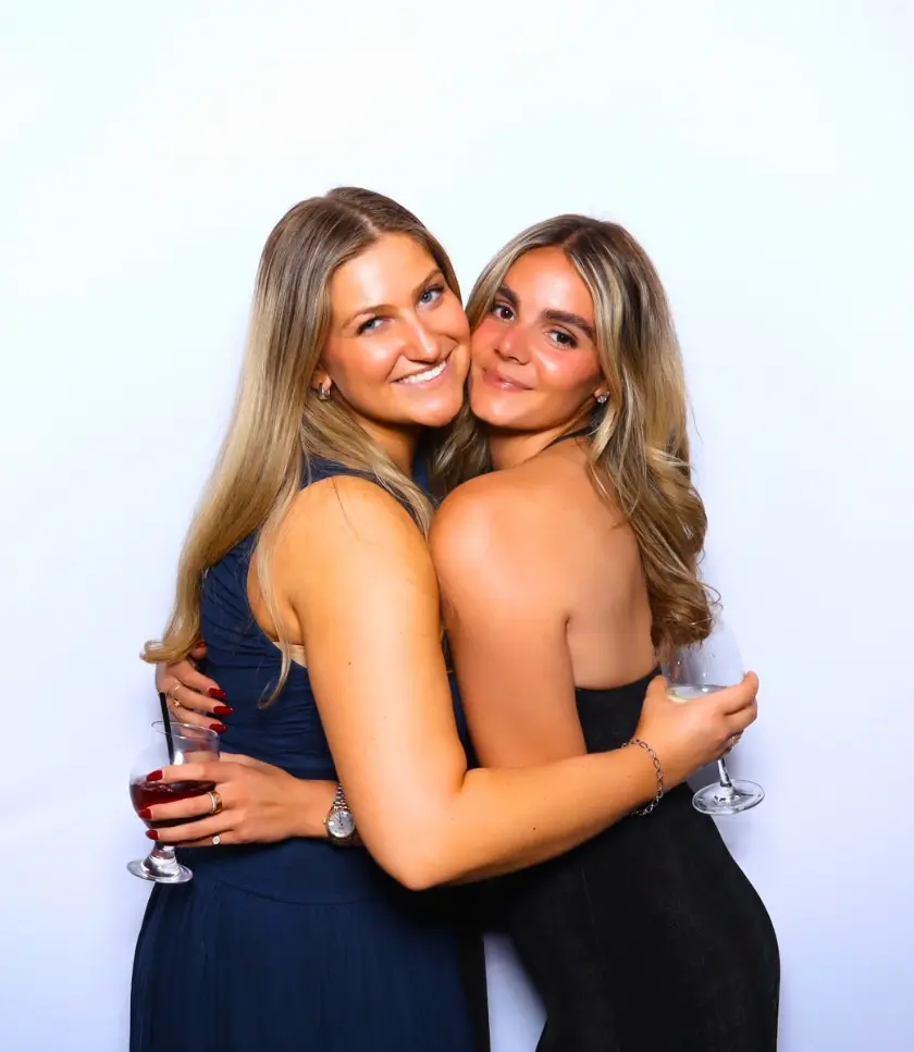Two women hugging and smiling