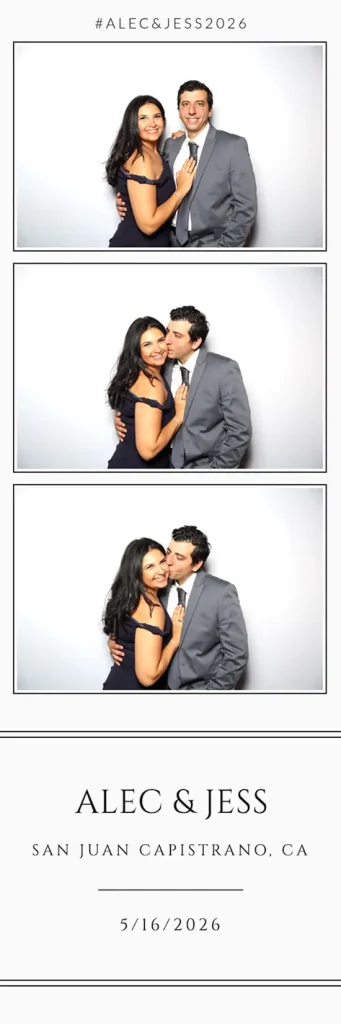Couple embraces as the man gives her a cheek kiss in a romantic photo booth pose.