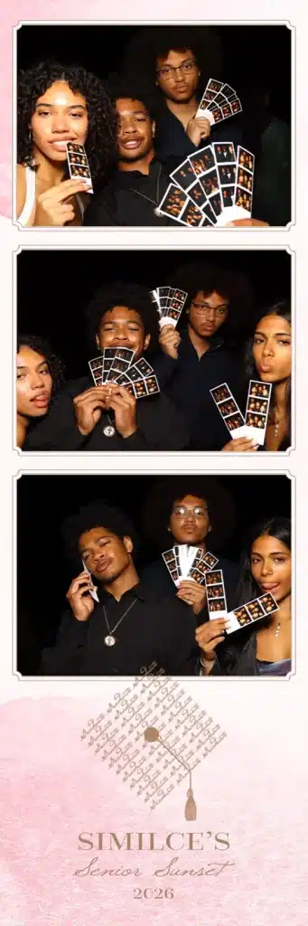 Four friends hold photo booth strips and strike playful poses together