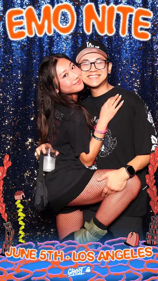Woman raises legs on a man's lap and kisses his cheek